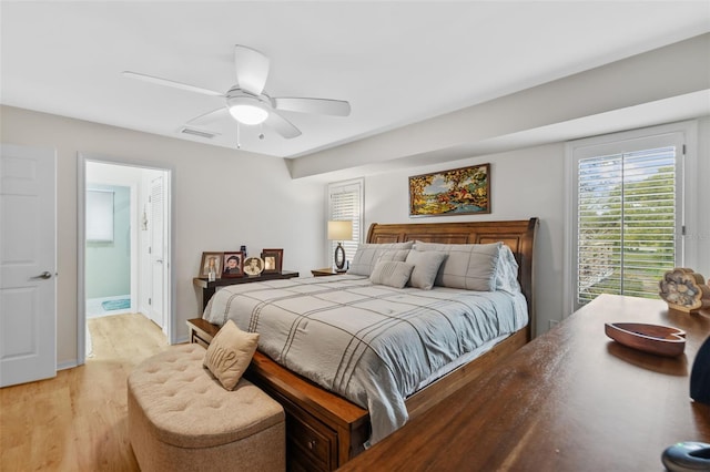 bedroom featuring a ceiling fan, access to exterior, baseboards, visible vents, and light wood-style floors