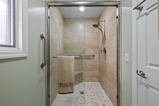 bathroom featuring a shower stall