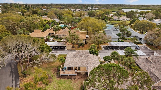 birds eye view of property with a residential view and a water view