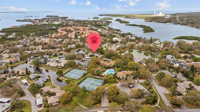 drone / aerial view featuring a water view and a residential view