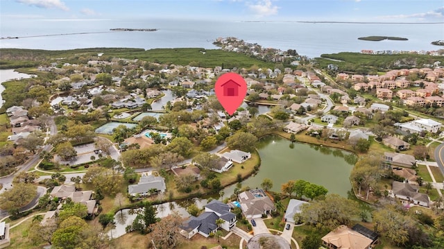 birds eye view of property with a residential view and a water view