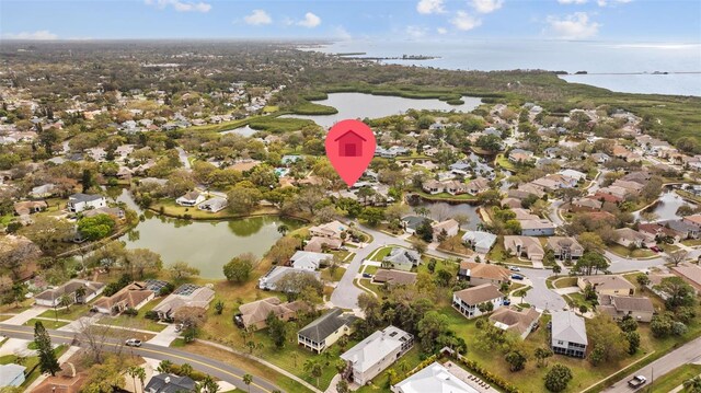 bird's eye view with a residential view and a water view