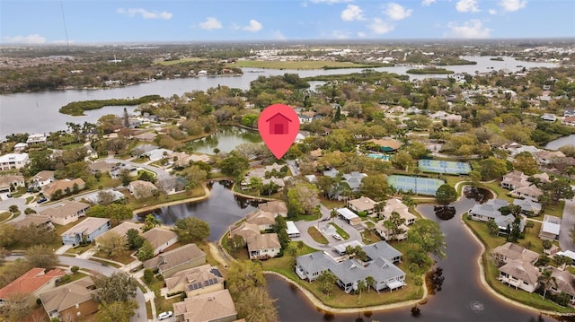 birds eye view of property featuring a water view and a residential view