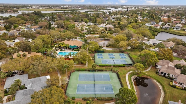 birds eye view of property with a water view and a residential view