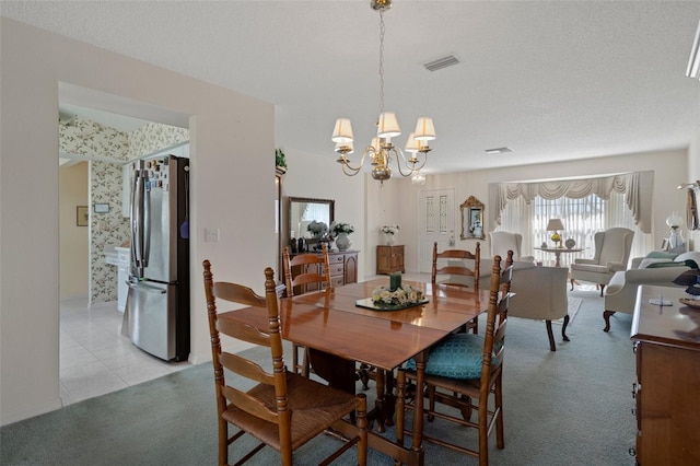 dining area with light tile patterned floors, light carpet, an inviting chandelier, and wallpapered walls