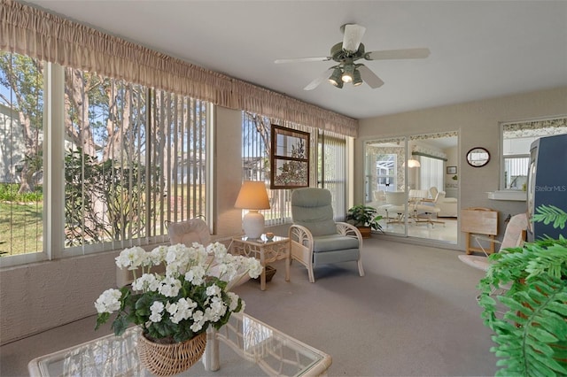 sunroom featuring ceiling fan