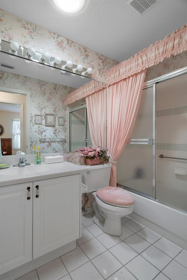 bathroom with visible vents, enclosed tub / shower combo, wallpapered walls, a textured ceiling, and tile patterned floors