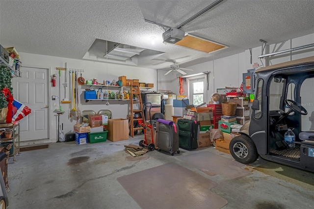 garage with a garage door opener and ceiling fan