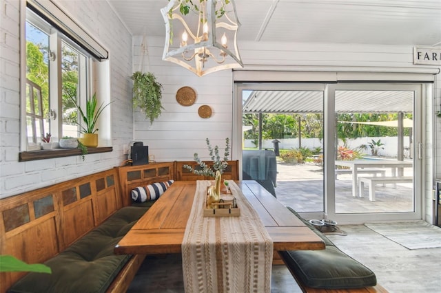 dining area with breakfast area, wood finished floors, and a wealth of natural light