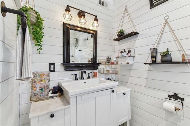 bathroom with visible vents and vanity