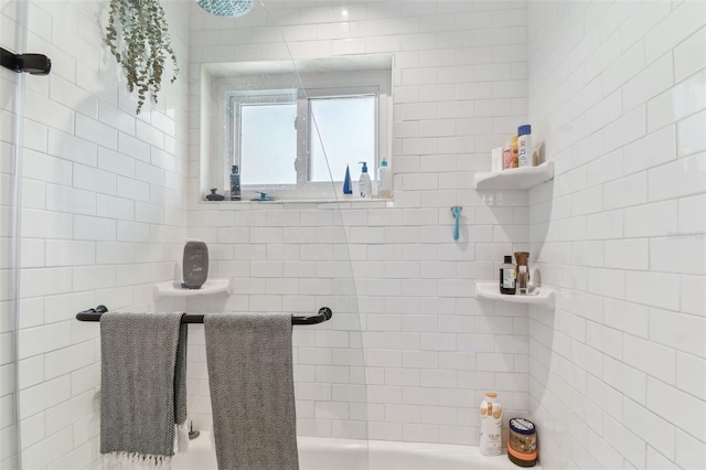 bathroom with a tile shower