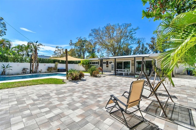 view of patio featuring a fenced backyard and a fenced in pool