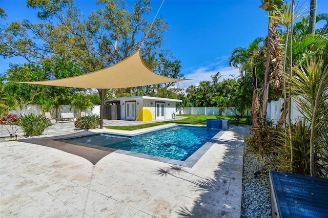 view of swimming pool with a fenced backyard, a storage structure, an outdoor structure, a fenced in pool, and a patio area