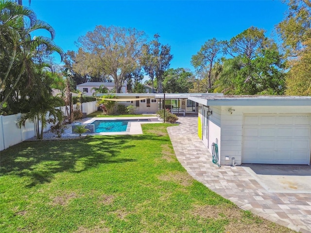 exterior space with a fenced backyard, a fenced in pool, and a lawn