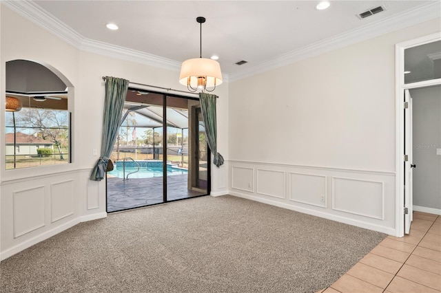 spare room with ornamental molding, recessed lighting, visible vents, and light tile patterned floors