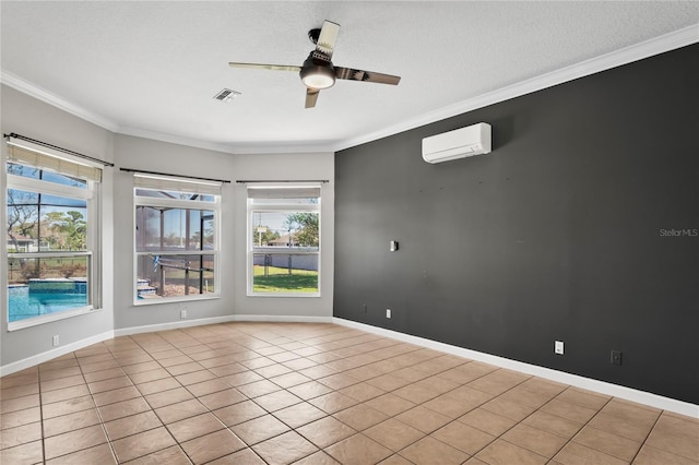 unfurnished room with visible vents, a healthy amount of sunlight, baseboards, ornamental molding, and a wall mounted air conditioner