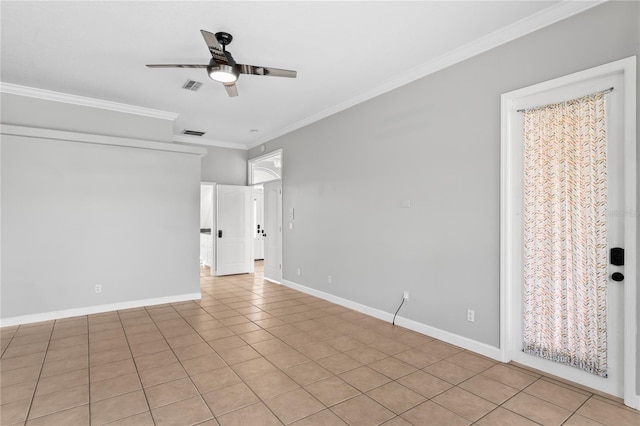 spare room featuring visible vents, crown molding, baseboards, and ceiling fan