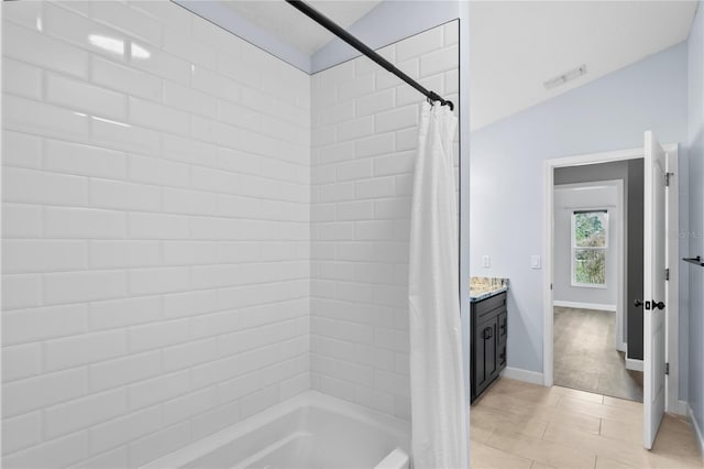 full bathroom with visible vents, shower / tub combo, vanity, baseboards, and tile patterned floors