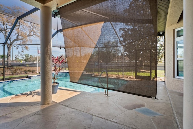 pool with a lanai and a patio area