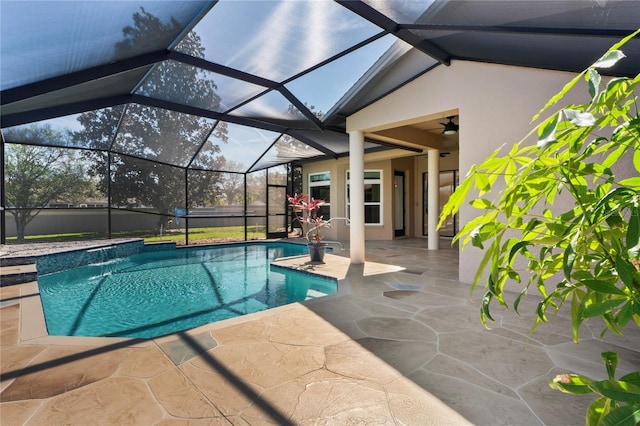 pool featuring ceiling fan, a patio, and a lanai