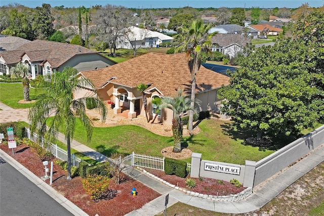 birds eye view of property with a residential view