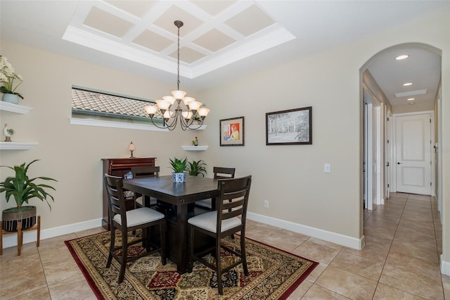 dining space featuring arched walkways, coffered ceiling, baseboards, and light tile patterned floors