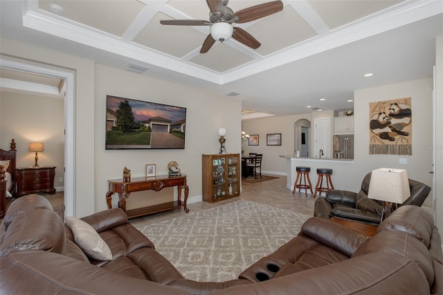 living room with coffered ceiling, arched walkways, visible vents, and baseboards