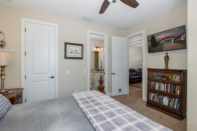 carpeted bedroom featuring ceiling fan and visible vents