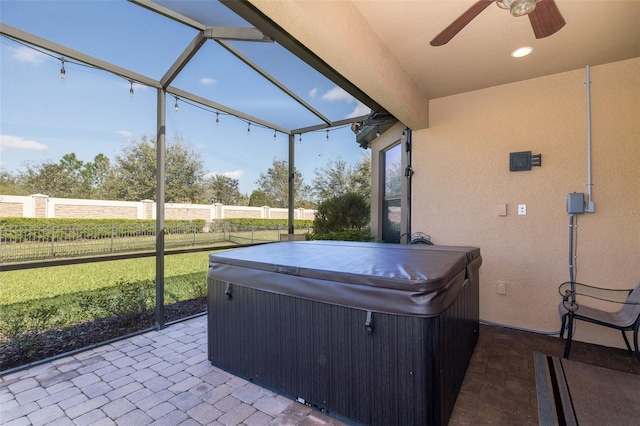 sunroom featuring a hot tub