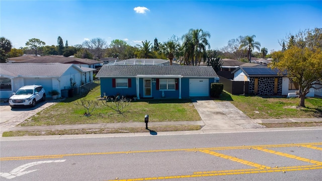 single story home featuring driveway, a garage, and a front lawn