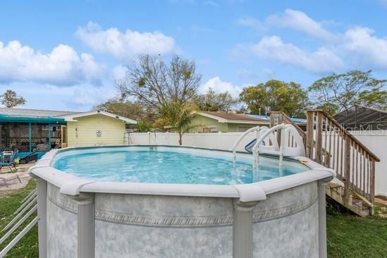 view of pool with fence and a fenced in pool