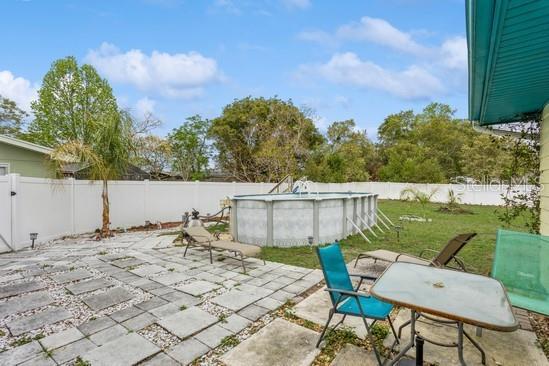 view of patio with a fenced in pool and a fenced backyard