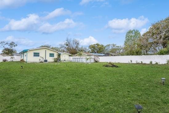 view of yard with a fenced backyard