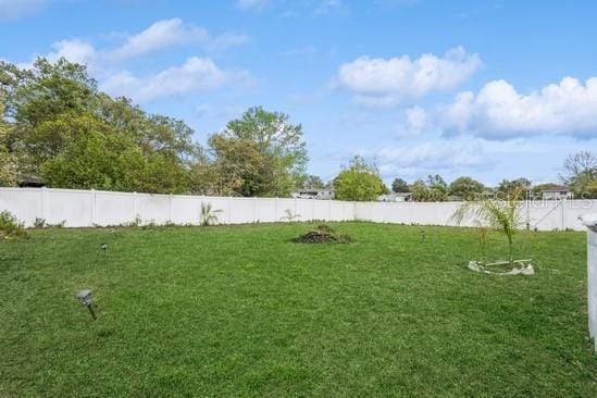 view of yard featuring a fenced backyard