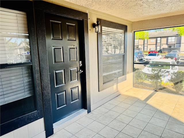 doorway to property featuring a porch