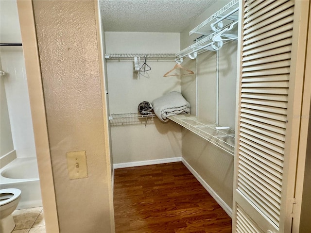 14736 Norwood Oaks Dr Unit 103, Tampa, FL 33613 - walk in closet with wood finished floors