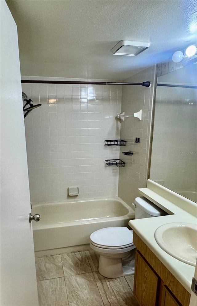 14736 Norwood Oaks Dr Unit 103, Tampa, FL 33613 - bathroom featuring a textured ceiling, tub / shower combination, vanity, and toilet