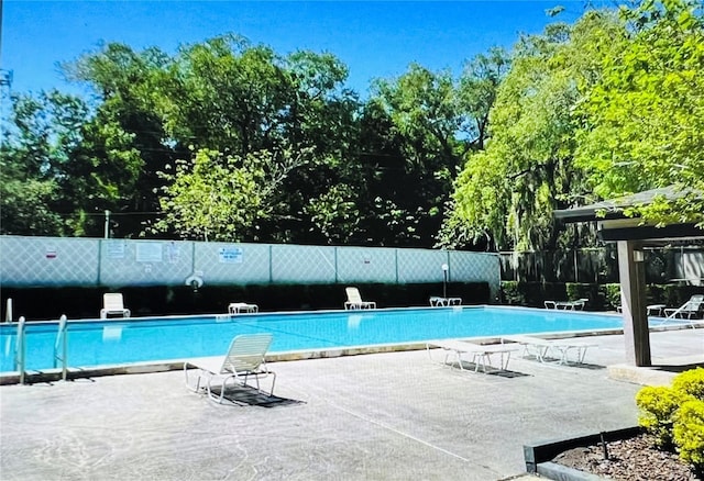 14736 Norwood Oaks Dr Unit 103, Tampa, FL 33613 - community pool with a patio area and fence