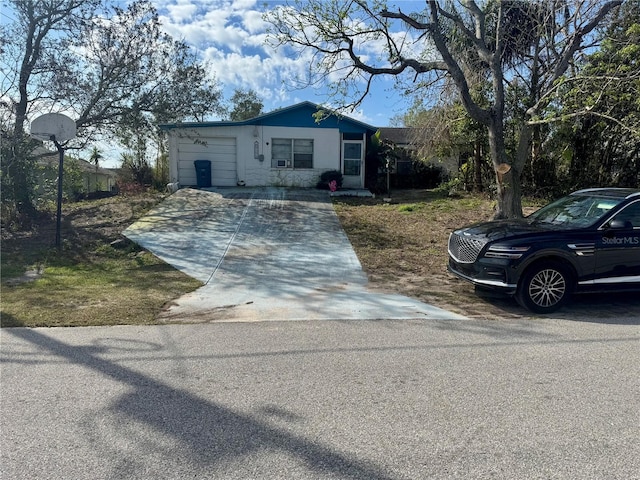 view of front of property with driveway and an attached garage