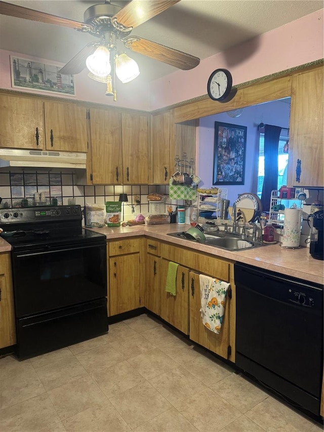 kitchen with under cabinet range hood, a sink, a ceiling fan, light countertops, and black appliances