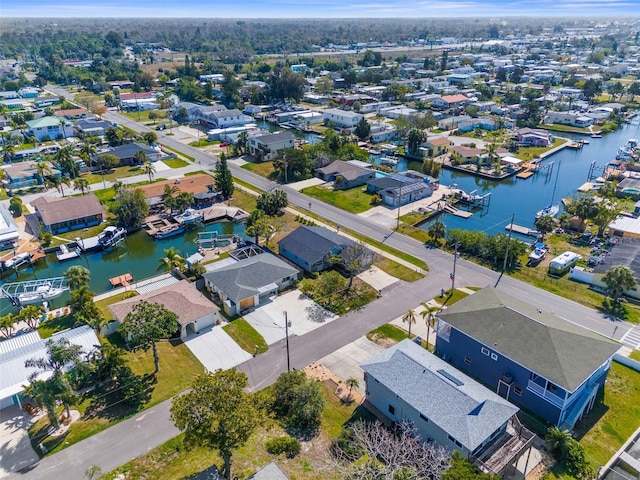 bird's eye view featuring a water view and a residential view