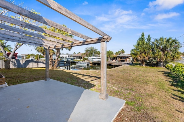 view of yard with a water view, a patio area, and a pergola