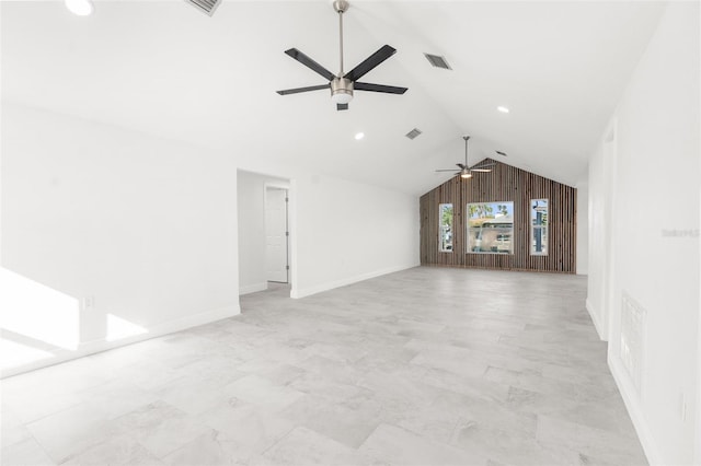 unfurnished living room with a ceiling fan, lofted ceiling, visible vents, and baseboards