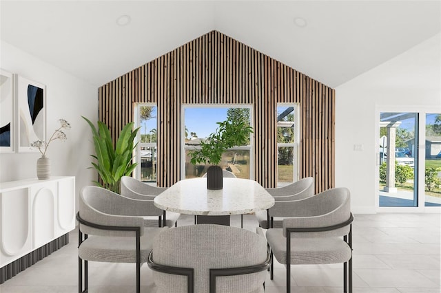 dining area featuring lofted ceiling