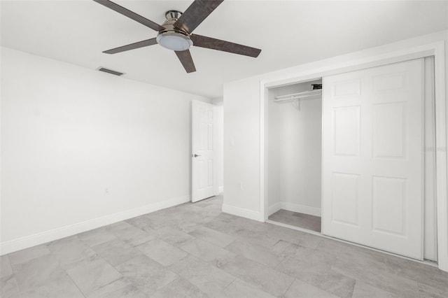 unfurnished bedroom featuring a ceiling fan, baseboards, visible vents, and a closet