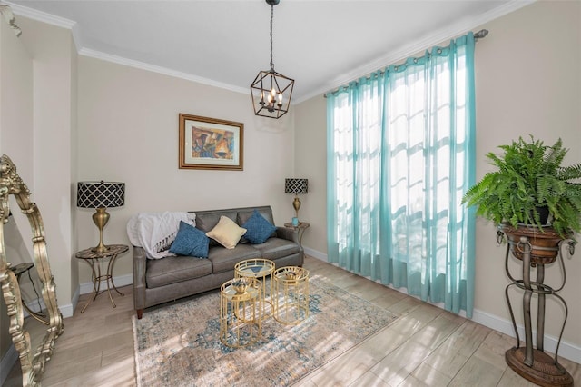 living area with ornamental molding, light wood-type flooring, and baseboards