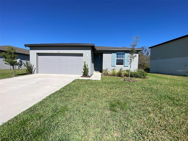 view of front of property featuring a garage, concrete driveway, a front lawn, and stucco siding