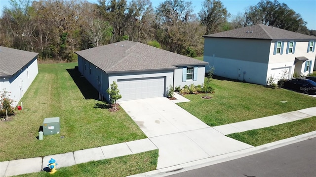 single story home featuring a garage, a front yard, driveway, and stucco siding