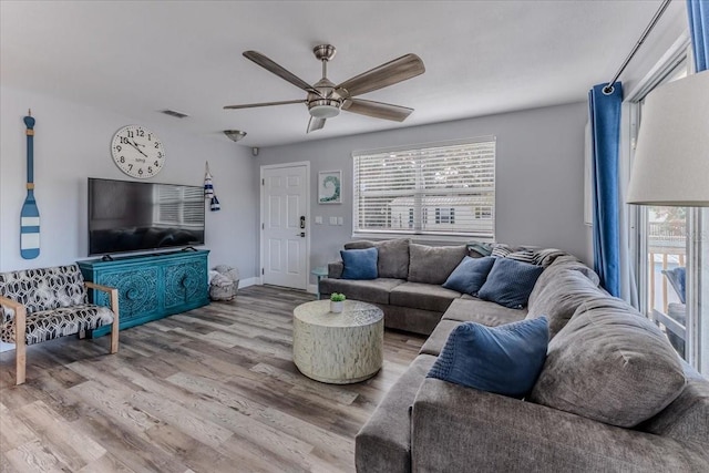 6183 Waverly Rd, Weeki Wachee, FL 34607 - living area featuring a ceiling fan and wood finished floors