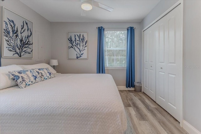 6183 Waverly Rd, Weeki Wachee, FL 34607 - bedroom featuring light wood finished floors, baseboards, a closet, and a ceiling fan
